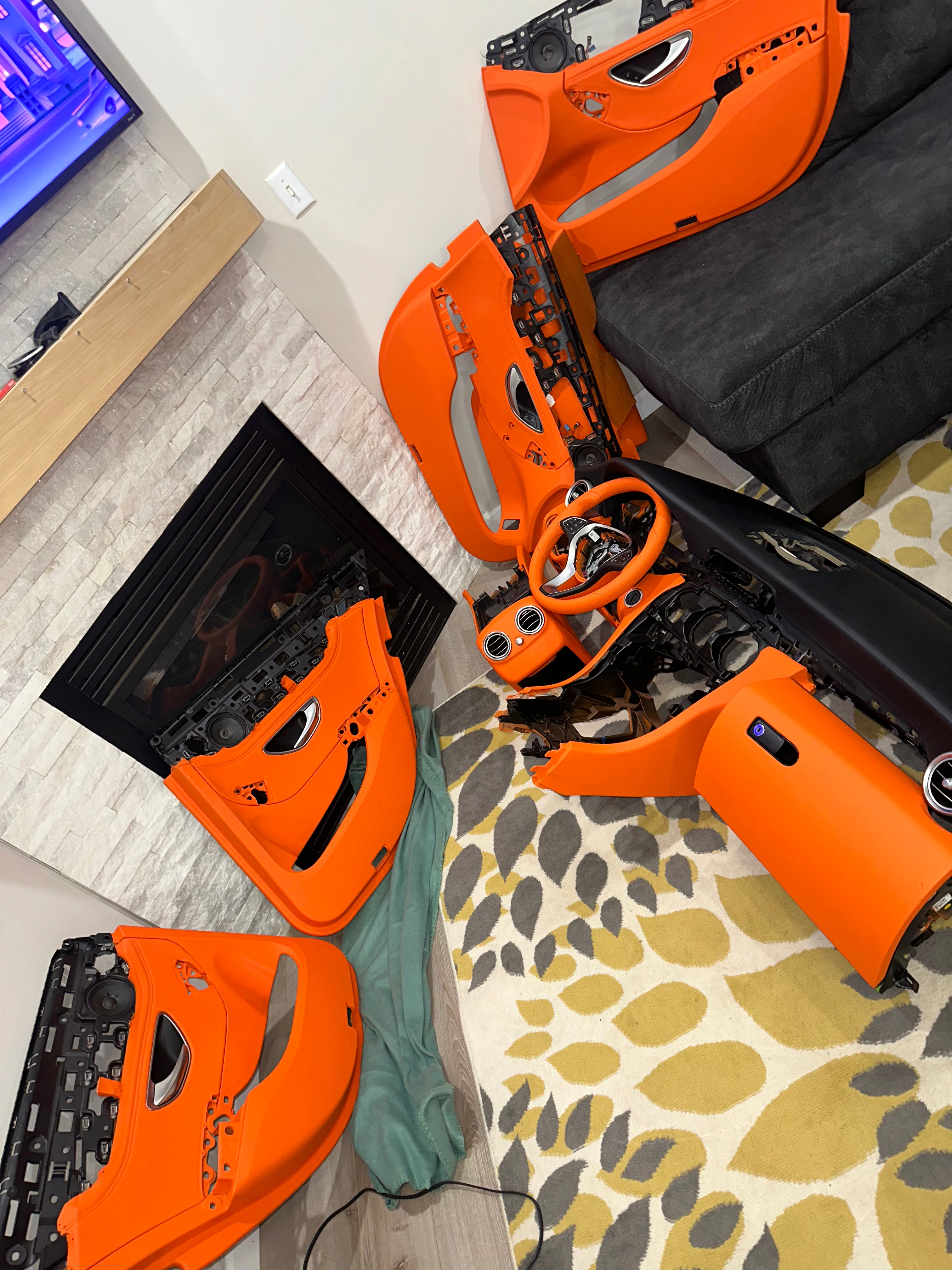 alt="Orange interior color change on car door panels and center console"