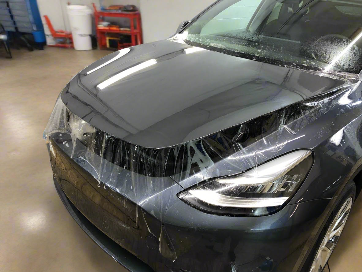 alt="Luxury sedan hood protected with Paint Protection Film for scratch resistance"