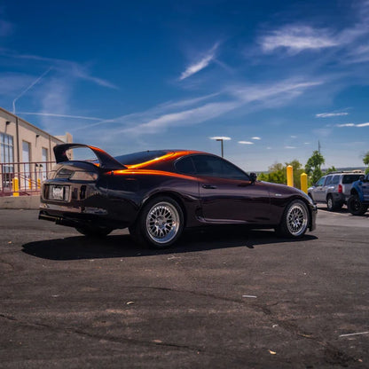 alt="Coupe wrapped in Gloss Devils Red parked outside in natural light"
