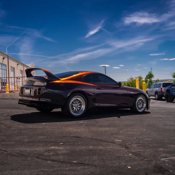 alt="Coupe wrapped in Gloss Devils Red parked outside in natural light"