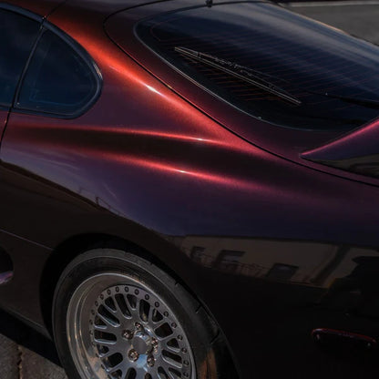 alt="Coupe wrapped in Gloss Devils Red parked outside in natural light"