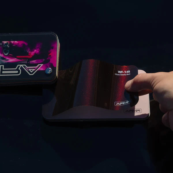 alt="Gloss Devils Red Color PPF sample book with vibrant red swatches"